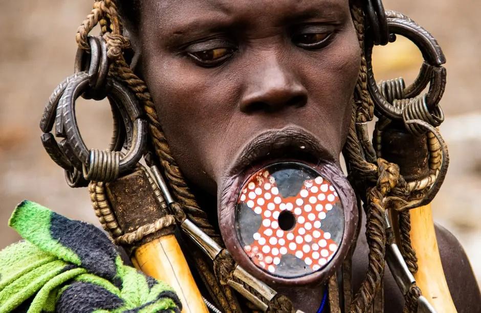 Portrait of a community member in traditional dress and jewelry